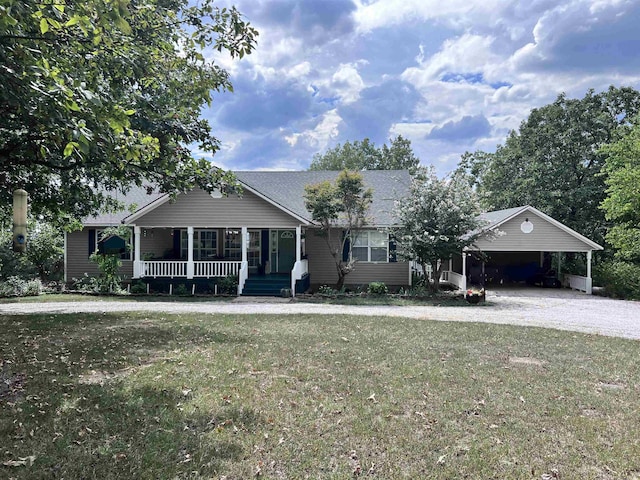 ranch-style house with covered porch, a front lawn, and a carport