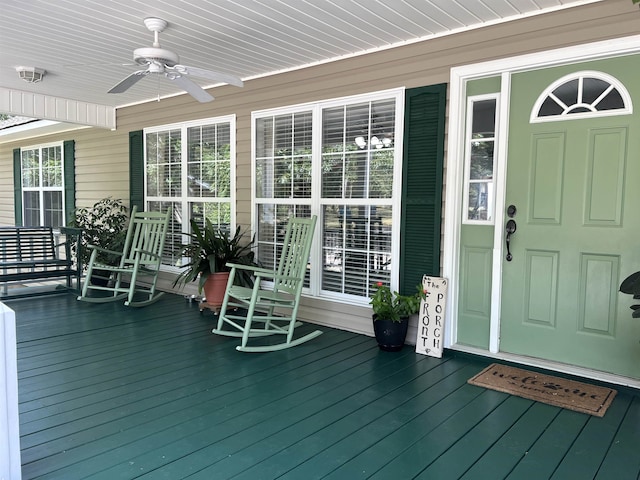 deck with ceiling fan and a porch