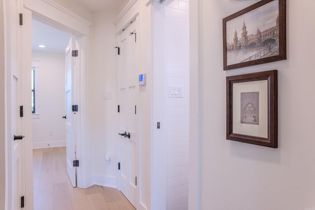 corridor featuring light hardwood / wood-style flooring