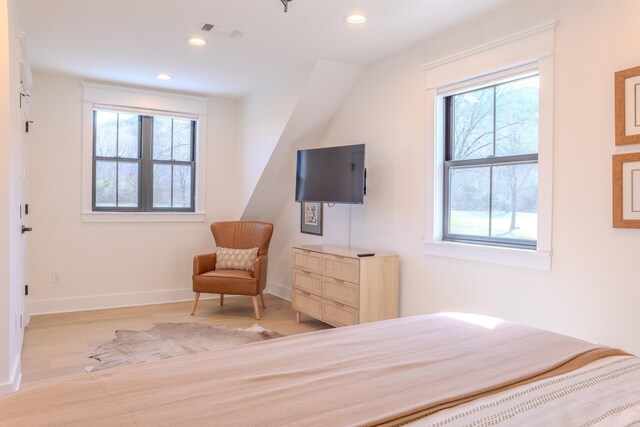 bedroom featuring recessed lighting, visible vents, multiple windows, and wood finished floors