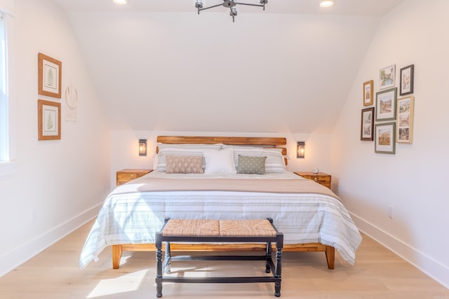 bedroom featuring recessed lighting, baseboards, lofted ceiling, and wood finished floors