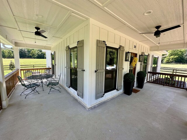 view of patio / terrace with ceiling fan and a porch