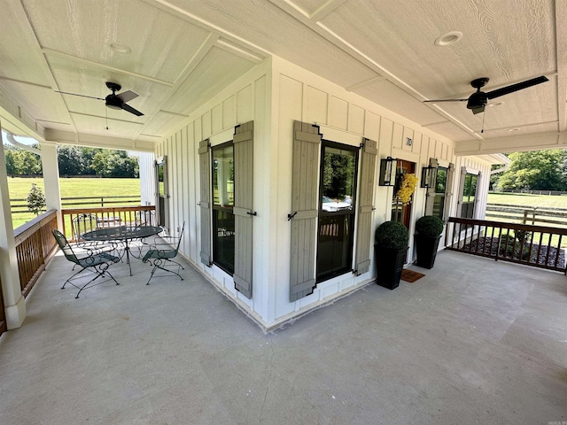 view of patio / terrace with a porch and a ceiling fan