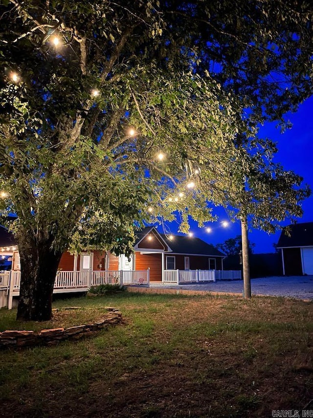 exterior space with a lawn and a porch