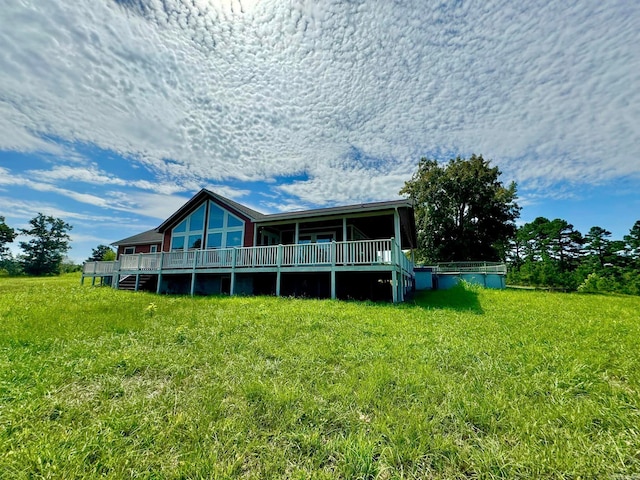 back of property featuring a yard