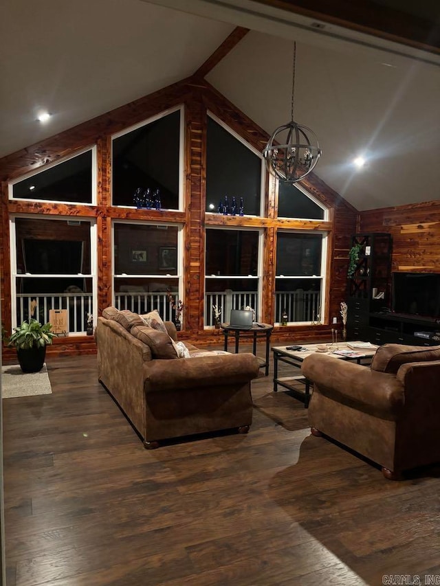 living room featuring high vaulted ceiling, wood-type flooring, an inviting chandelier, and beam ceiling