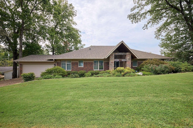 view of front of home featuring a garage and a front lawn