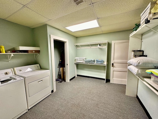 laundry area with visible vents, carpet, laundry area, and washer and clothes dryer