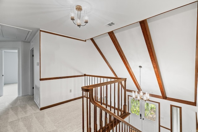 corridor with carpet floors, a chandelier, and vaulted ceiling with beams