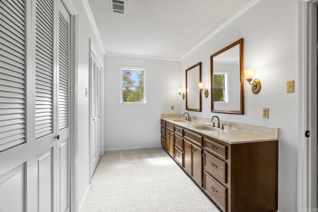 bathroom with crown molding and vanity