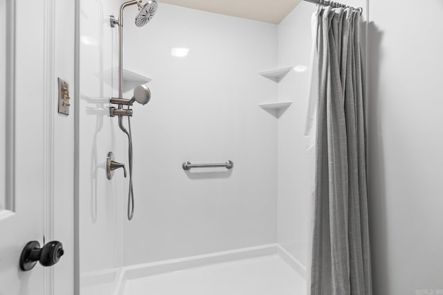 bathroom featuring a shower with curtain