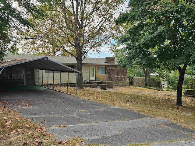 view of front facade with a carport