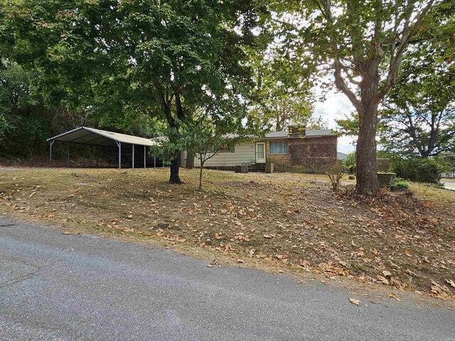 exterior space with a carport