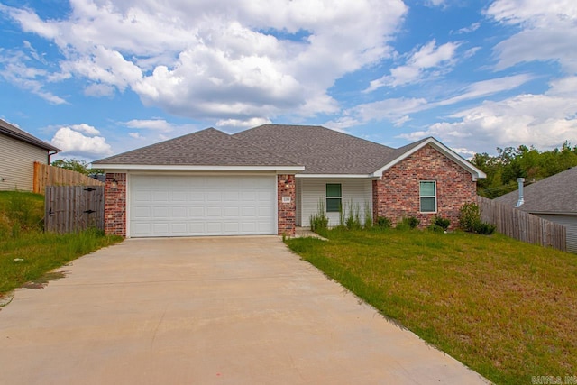 single story home with a garage and a front yard