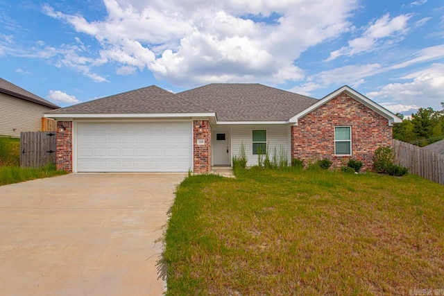 ranch-style home featuring a garage and a front lawn