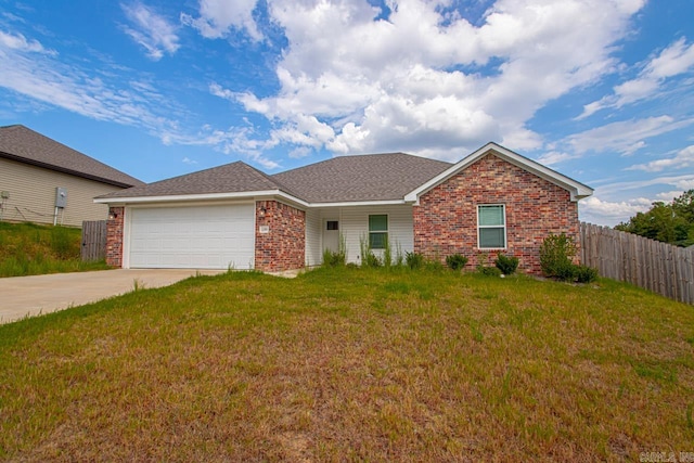 ranch-style house featuring a garage and a front yard