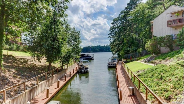 view of water feature with a dock