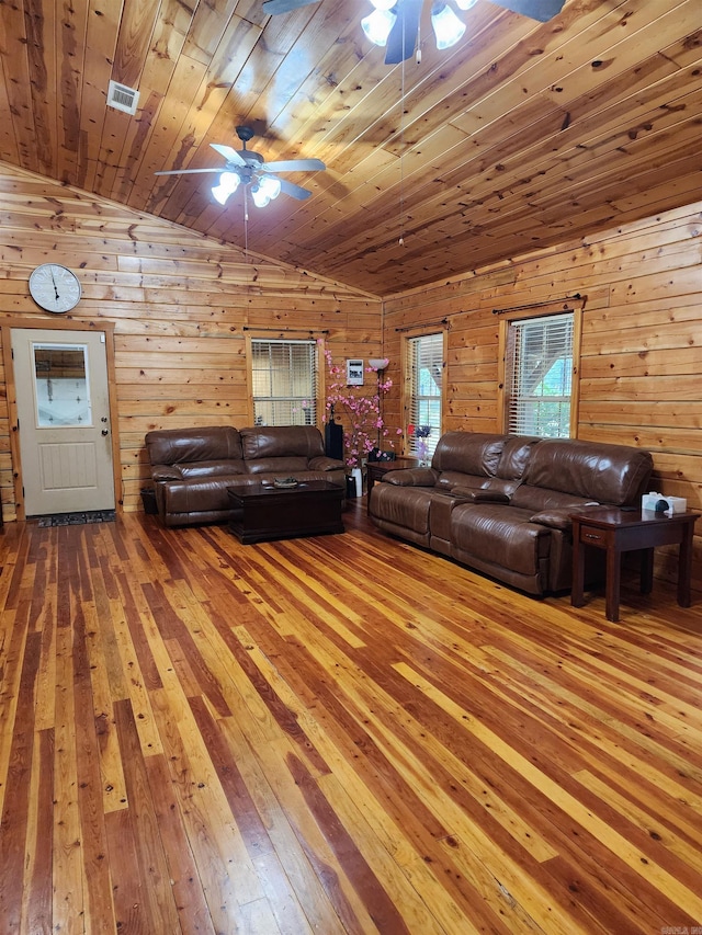 unfurnished living room with lofted ceiling, wood-type flooring, and ceiling fan