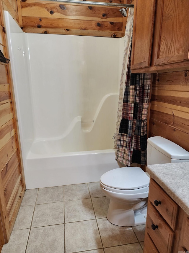 full bathroom featuring shower / bath combination with curtain, toilet, and tile patterned flooring