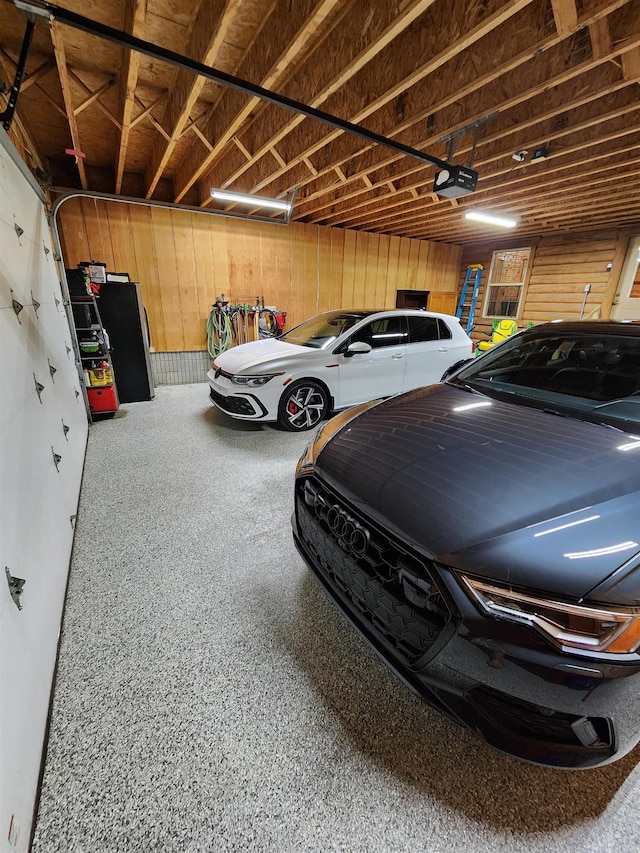 garage featuring wooden walls