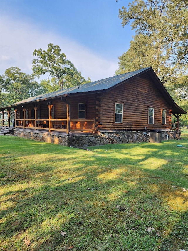 rear view of house with a yard