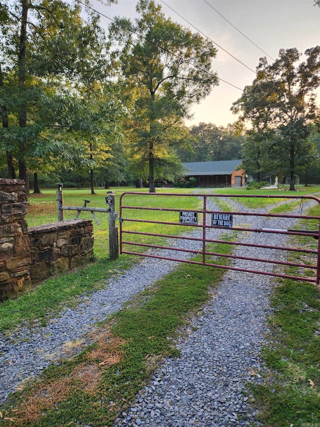 gate at dusk with a lawn