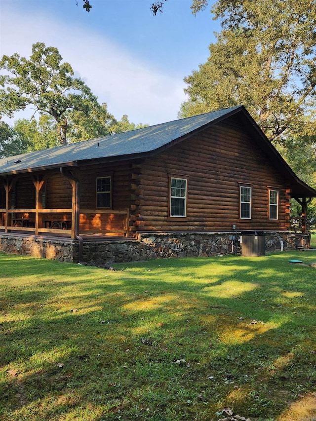 view of side of home featuring a lawn