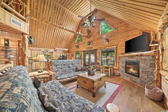 unfurnished living room with a fireplace, high vaulted ceiling, wood-type flooring, ceiling fan, and wood ceiling