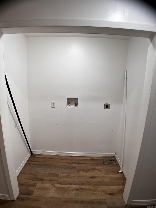 clothes washing area featuring dark hardwood / wood-style floors, washer hookup, and electric dryer hookup