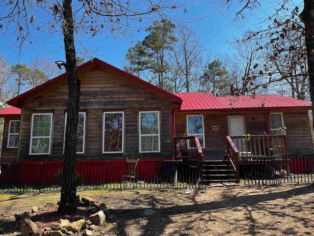 view of front facade with a wooden deck