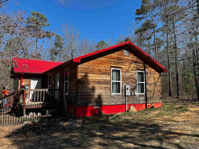 view of side of property featuring a porch