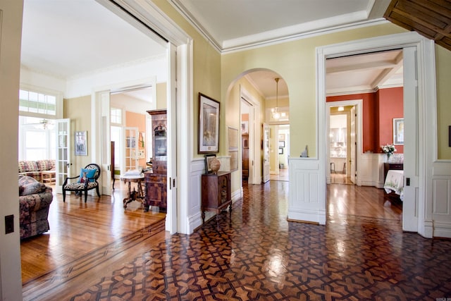 corridor featuring dark wood-type flooring and crown molding