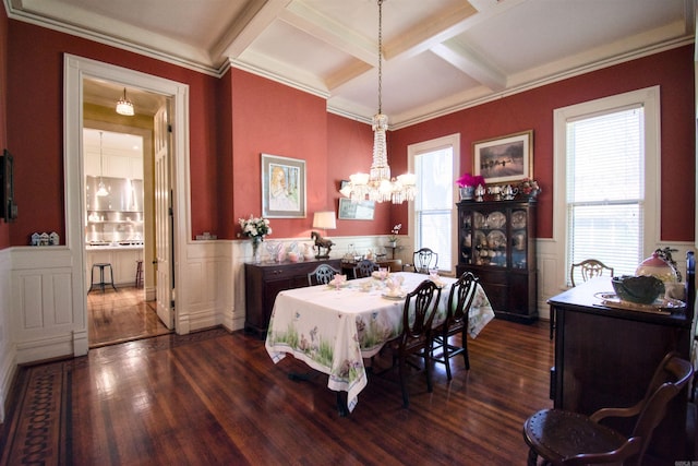 dining area featuring crown molding, dark hardwood / wood-style flooring, a healthy amount of sunlight, and coffered ceiling