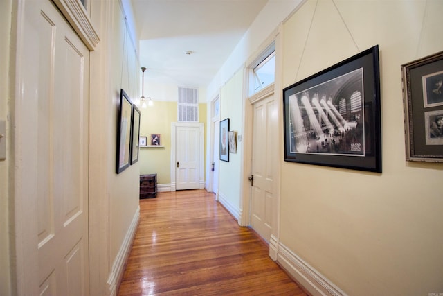 hallway featuring wood-type flooring