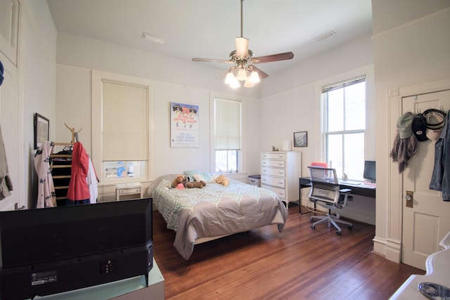 bedroom featuring dark wood-type flooring and ceiling fan