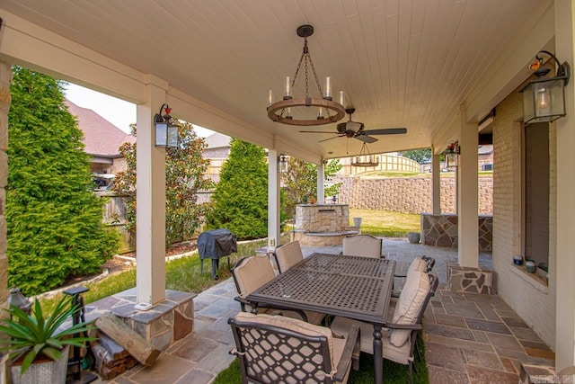 view of patio with area for grilling and ceiling fan