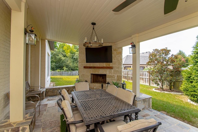 view of patio with an outdoor stone fireplace