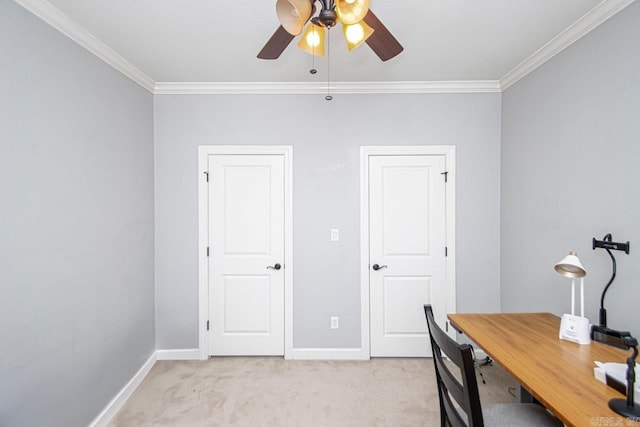 office space with crown molding, ceiling fan, and light colored carpet