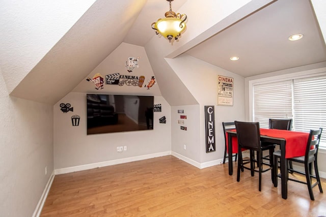 interior space with light hardwood / wood-style flooring and vaulted ceiling