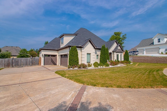 view of front of house featuring a garage and a front yard