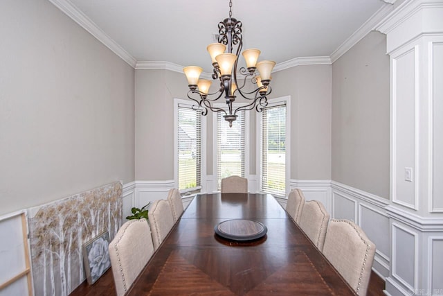 dining space featuring crown molding, dark hardwood / wood-style floors, and a chandelier