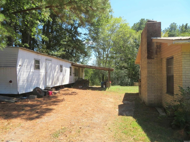 view of yard featuring a carport