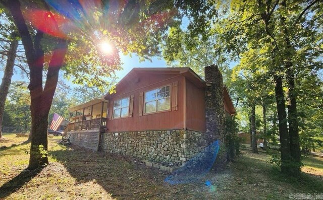 view of property exterior featuring a deck