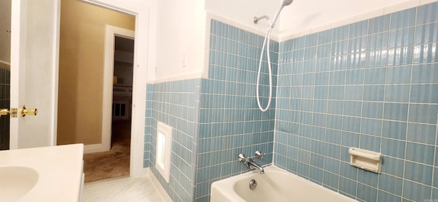 bathroom with tile walls and shower / bathing tub combination