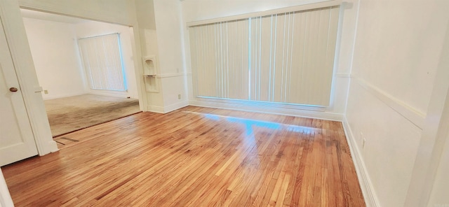 unfurnished room featuring light hardwood / wood-style floors