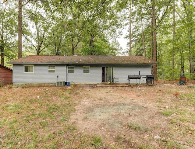 rear view of property featuring cooling unit