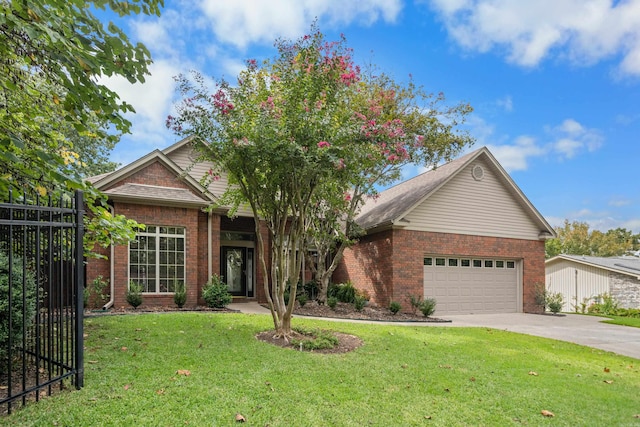 view of front of house featuring a garage and a front yard