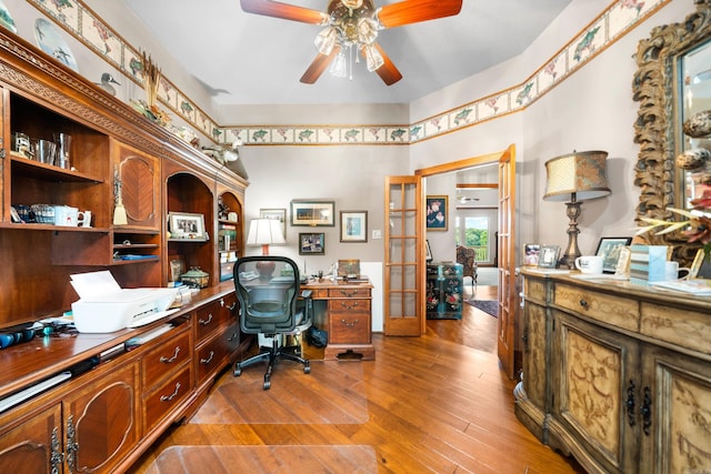 office featuring light wood-type flooring and ceiling fan