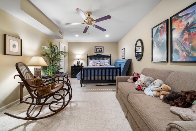 bedroom featuring ceiling fan and light carpet