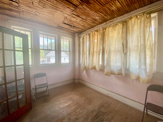 unfurnished sunroom featuring wood ceiling